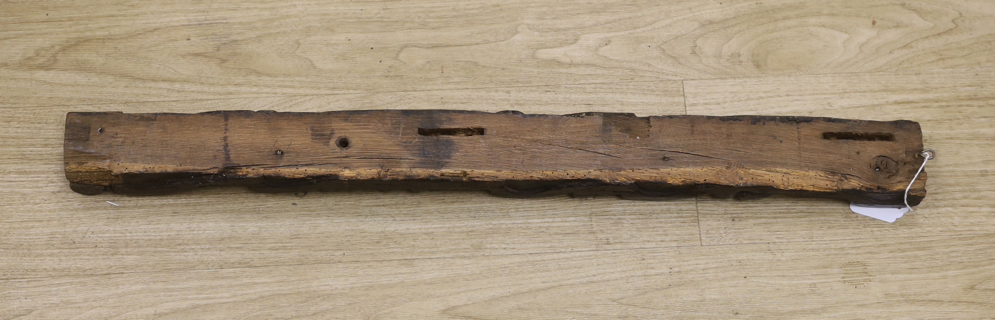 An 18th century carved oak figural pilaster, 83cm long